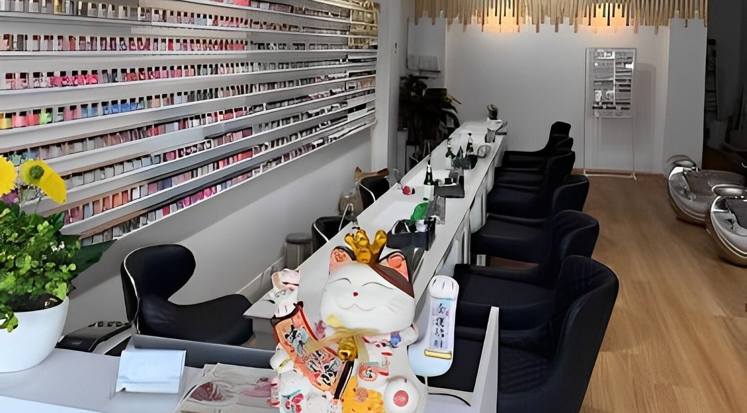 Interior of Abby Nails And Beauty, Melbourne, Victoria, AU, showcasing vibrant nail polish displays and cozy seating.