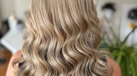 Elegant wavy blonde hairstyle at Hey Jude Hair Salon, Clearview, South Australia, AU.