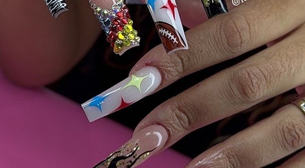 Vibrant nail art at Kayden Luong in Atlanta, Georgia, US, featuring colorful gems and unique designs.