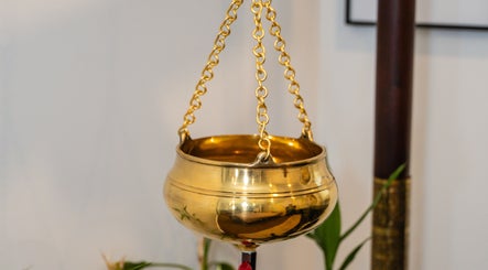 Golden ceremonial bowl at Kundalini Temple, Kellyville, New South Wales, AU reflecting serene ambiance.