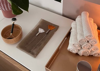 Relaxing spa setup at AR Massage Therapy, Leeds, England, GB with massage tools and candles.