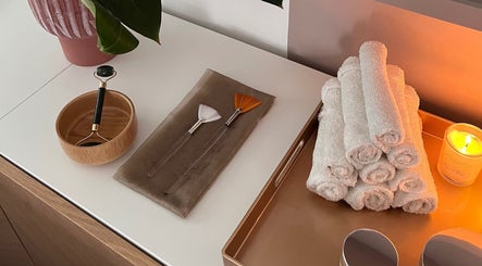 Relaxing spa setup at AR Massage Therapy, Leeds, England, GB with massage tools and candles.