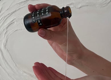 Hands pouring aromatic oil at AR Massage Therapy, Leeds, England, GB.