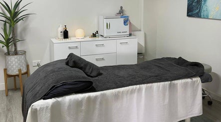 Tranquil massage room at Massage Relax Restore Townsville, Garbutt, Queensland, AU with a cozy bed setup.