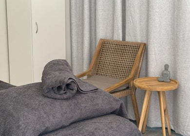Calm massage room at Massage Relax Restore Townsville, Garbutt, Queensland, AU with towels and a serene ambiance.
