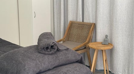 Relaxing massage room in Massage Relax Restore Townsville, Garbutt, Queensland, AU with cozy towels and tranquil decor.