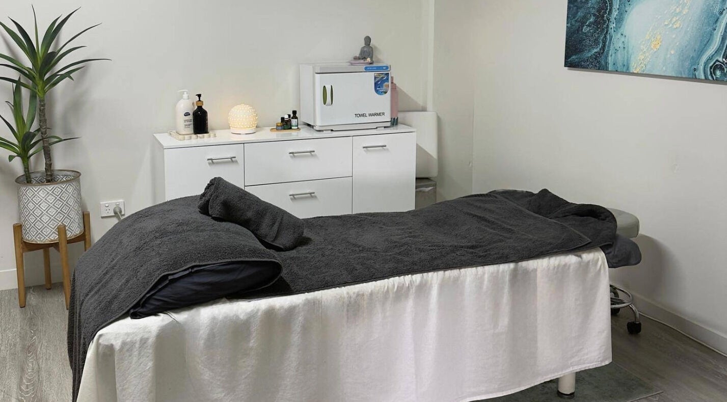 Tranquil massage room at Massage Relax Restore Townsville in Garbutt, Queensland, AU with cozy linens.