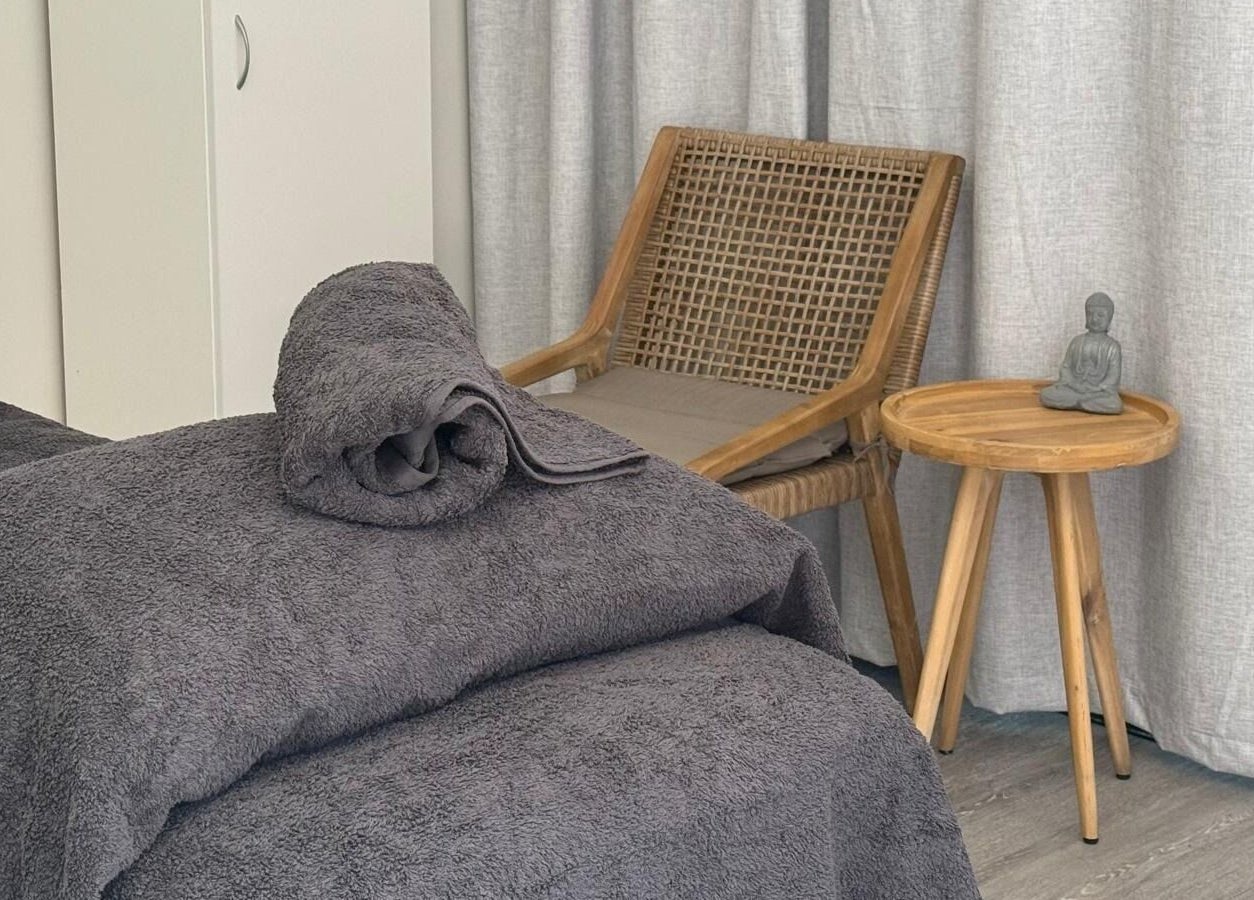 Relaxing massage room at Massage Relax Restore Townsville, Garbutt, Queensland, AU with cozy towels and zen decor.