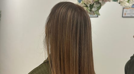 Sleek, brown straight hair styled at Luxe Hair by Kamal, Lagos, Faro, PT, showcasing expert salon work.