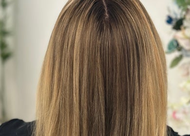 Glossy blonde hair from Luxe Hair by Kamal in Lagos, Faro, PT, showcasing expert styling and color.