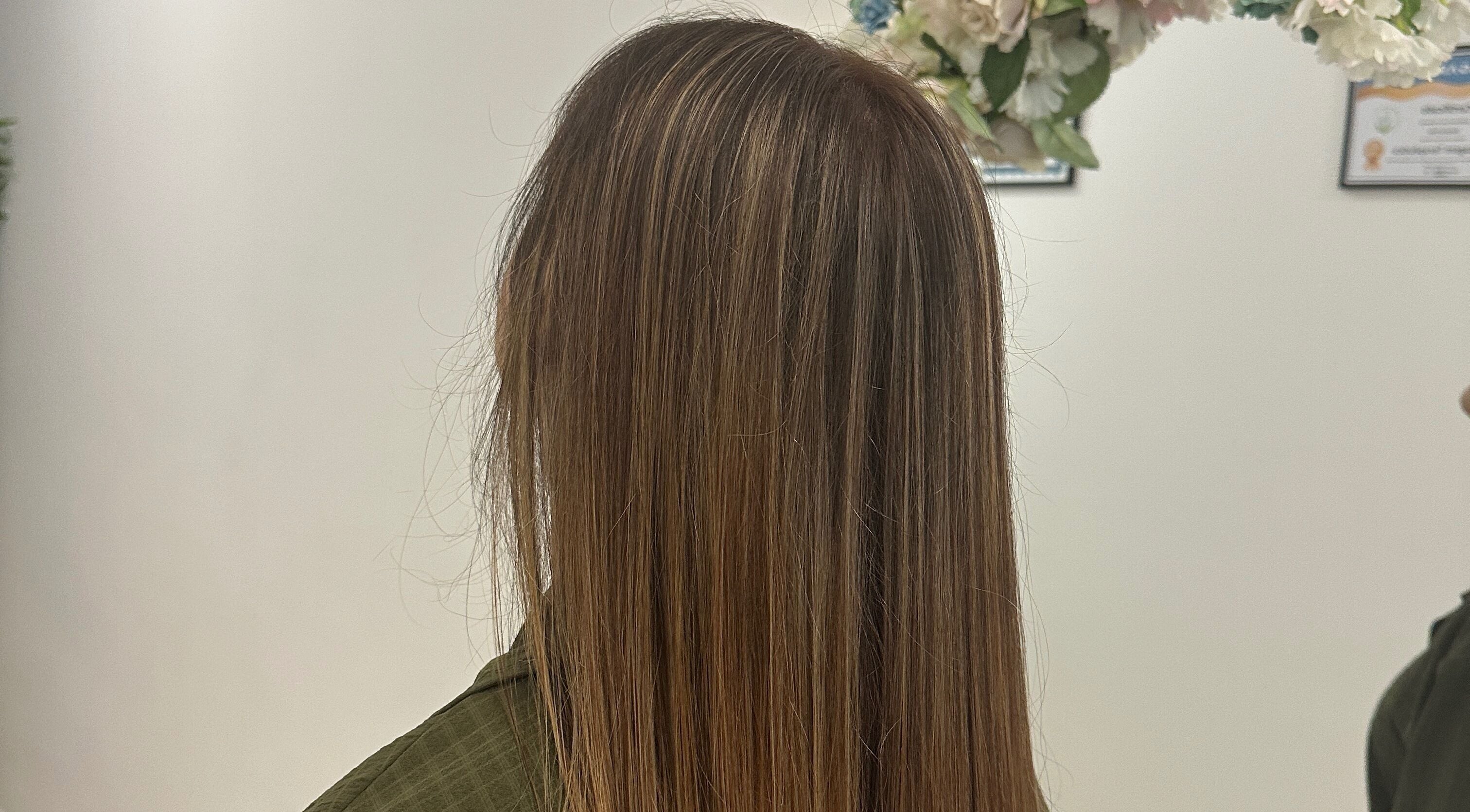 Smooth hair styling at Luxe Hair by Kamal, Lagos, Faro, PT. Experience professional hair care for stunning results.