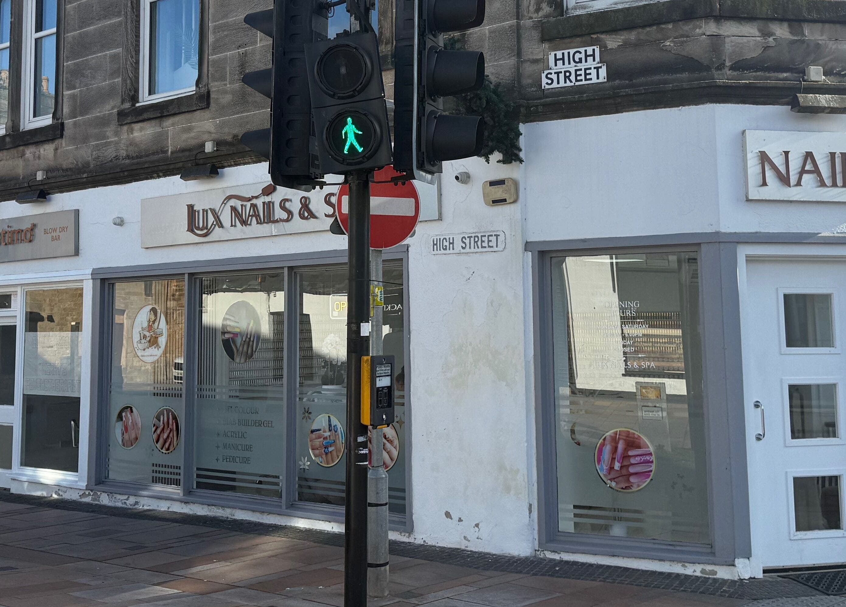 Exterior view of Lux Nails & Spa Carluke on High Street, Carluke, Scotland, GB with inviting signage.