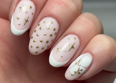 Elegant gold-accented nail art at Keexbeauty, Newport, Wales, GB showcasing luxury designs.