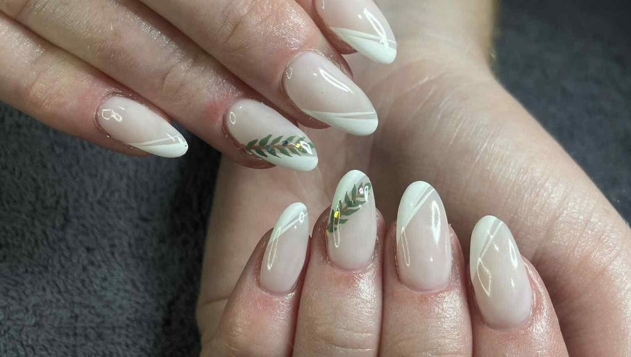 Nail art with leaf design at Leaf of Faith Beauty, Benoni, Gauteng, ZA, showcasing elegant style.