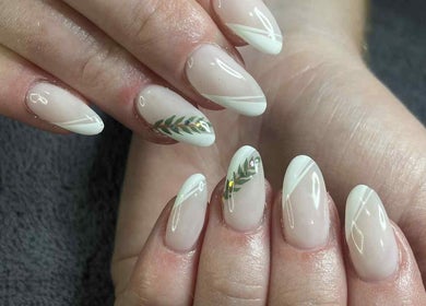 Nail art with leaf design at Leaf of Faith Beauty, Benoni, Gauteng, ZA, showcasing elegant style.