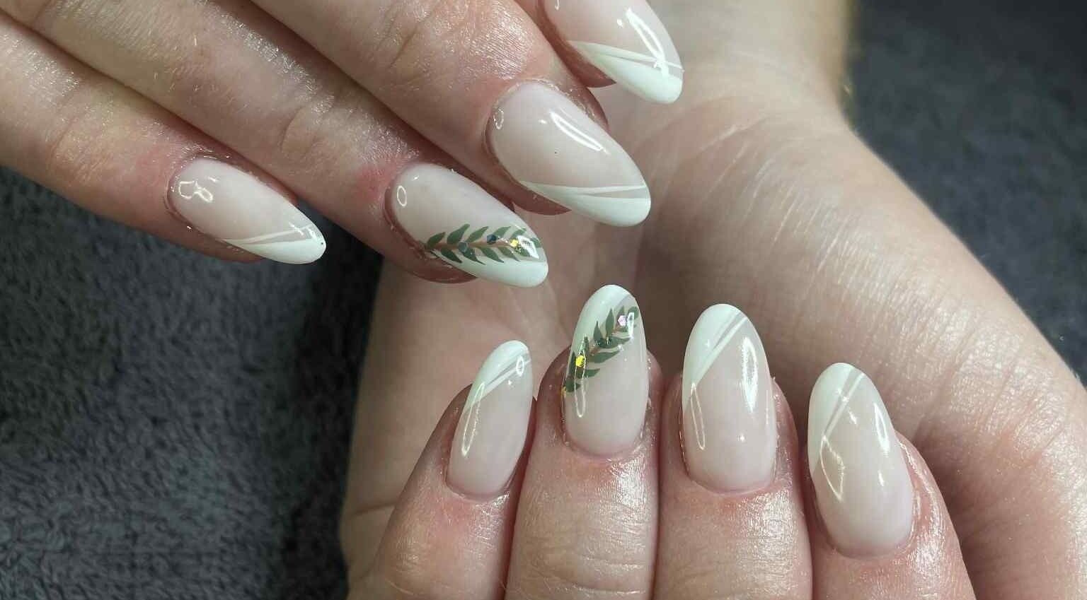 Nail art with leaf design at Leaf of Faith Beauty, Benoni, Gauteng, ZA, showcasing elegant style.