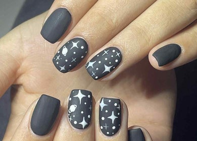Stylish cosmic-themed nails at Leaf of Faith Beauty, Benoni, Gauteng, ZA showcasing unique design.