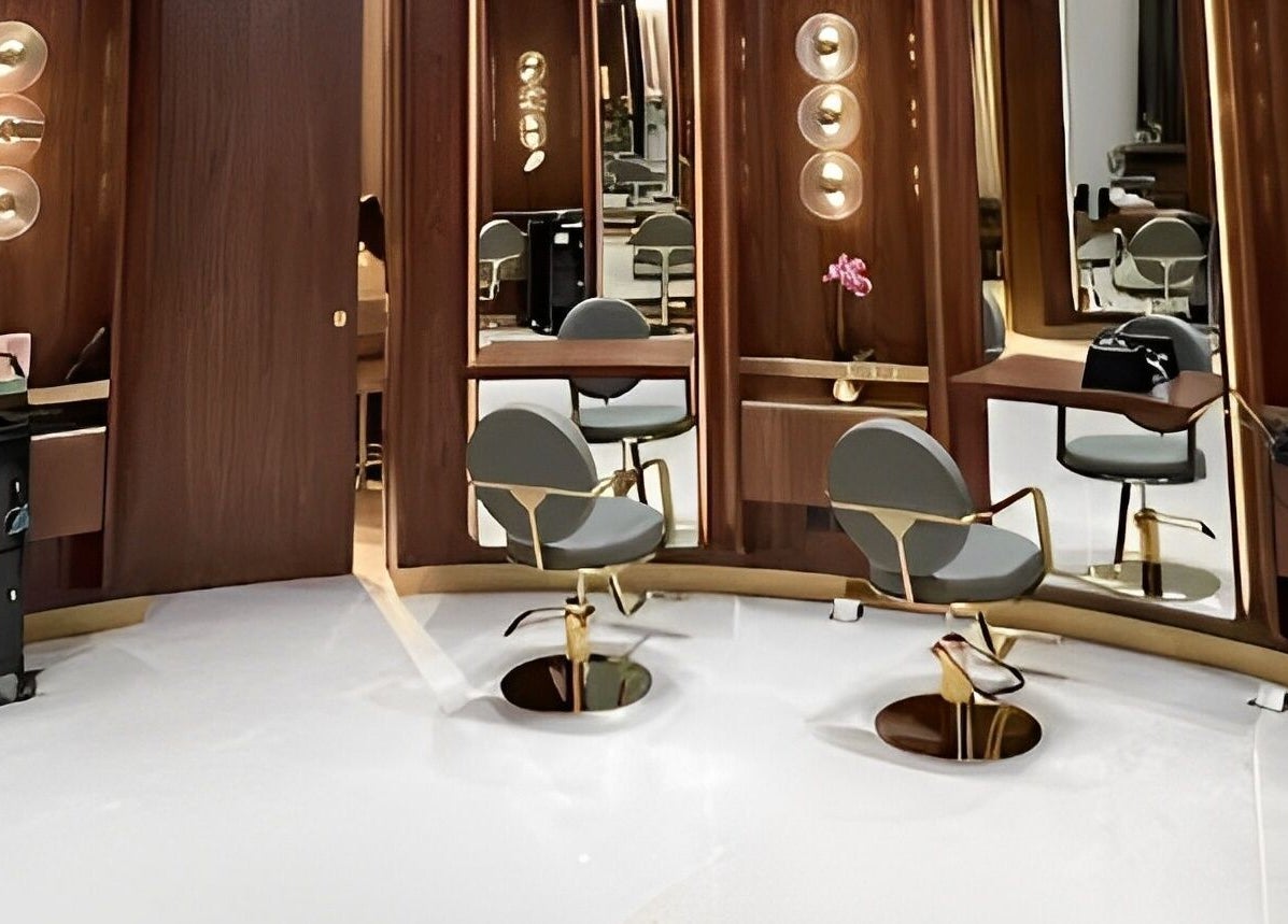 Modern salon setup at The Outré, Riyadh, Riyadh Province, SA with sleek chairs and elegant lighting.
