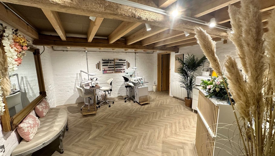 Chic nail salon interior at Nails by Nadiia, Ashbourne, England, GB featuring cozy seating and nail stations.