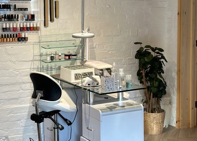 Nail studio setup at Nails by Nadiia, Ashbourne, England, GB with modern decor and polish collection.