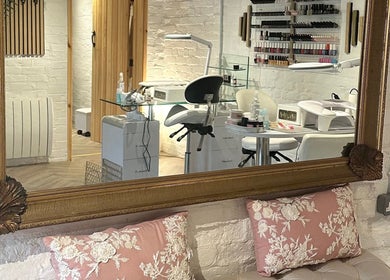 Elegant nail salon at Nails by Nadiia, Ashbourne, England, GB, featuring stylish decor and manicure stations.