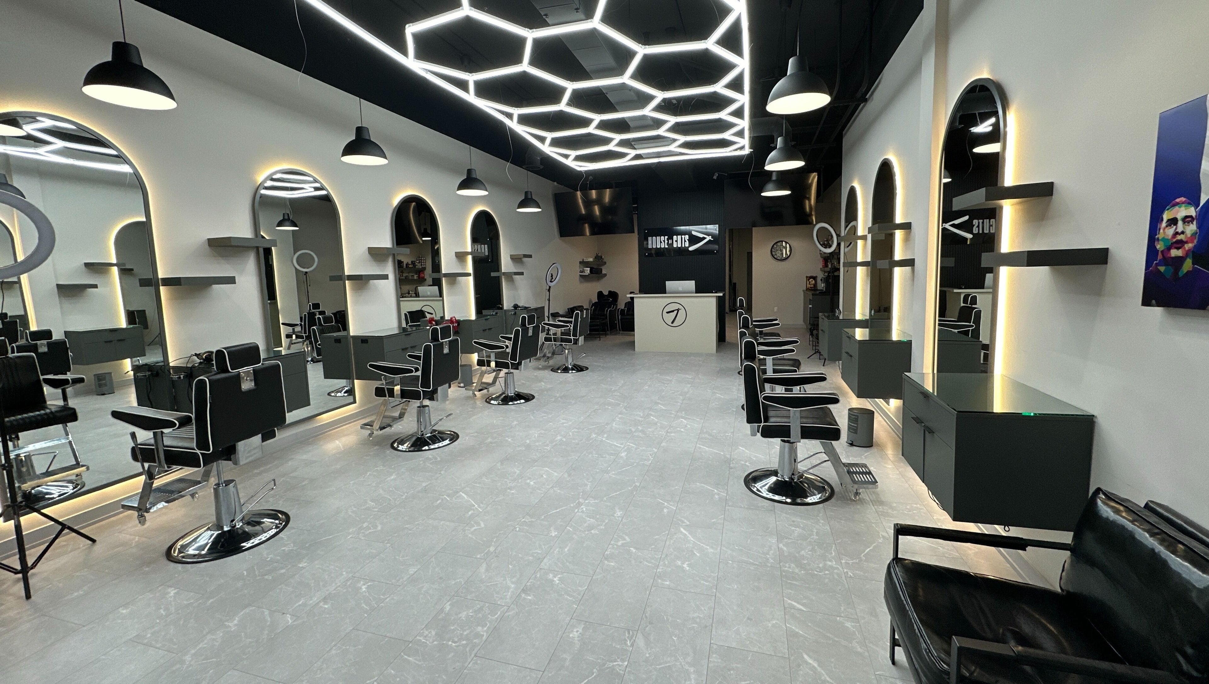 Modern styling chairs and mirrors at House of Cuts, Vaughan, Ontario, CA, showcasing sleek salon design.