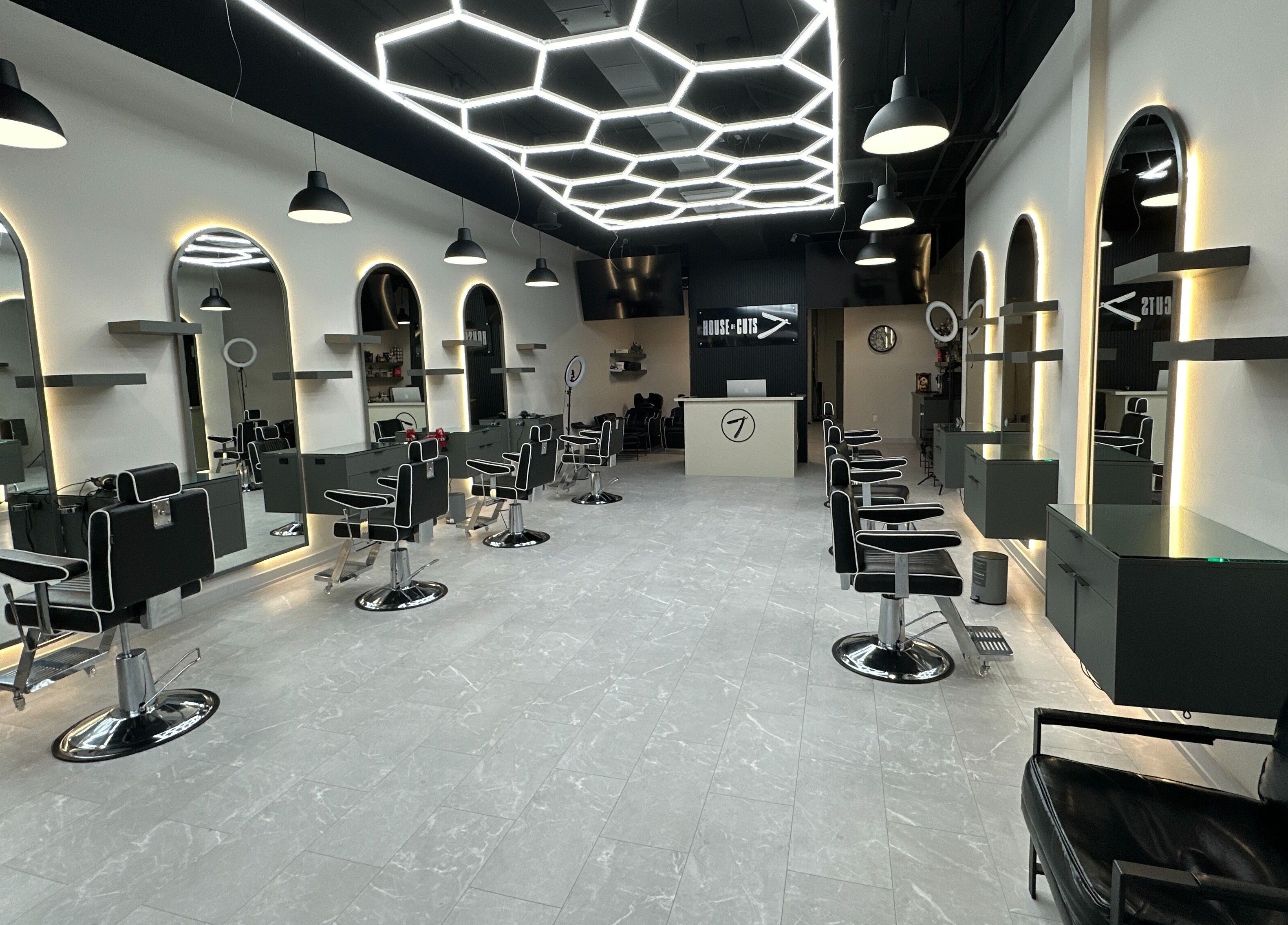 Modern styling chairs and mirrors at House of Cuts, Vaughan, Ontario, CA, showcasing sleek salon design.