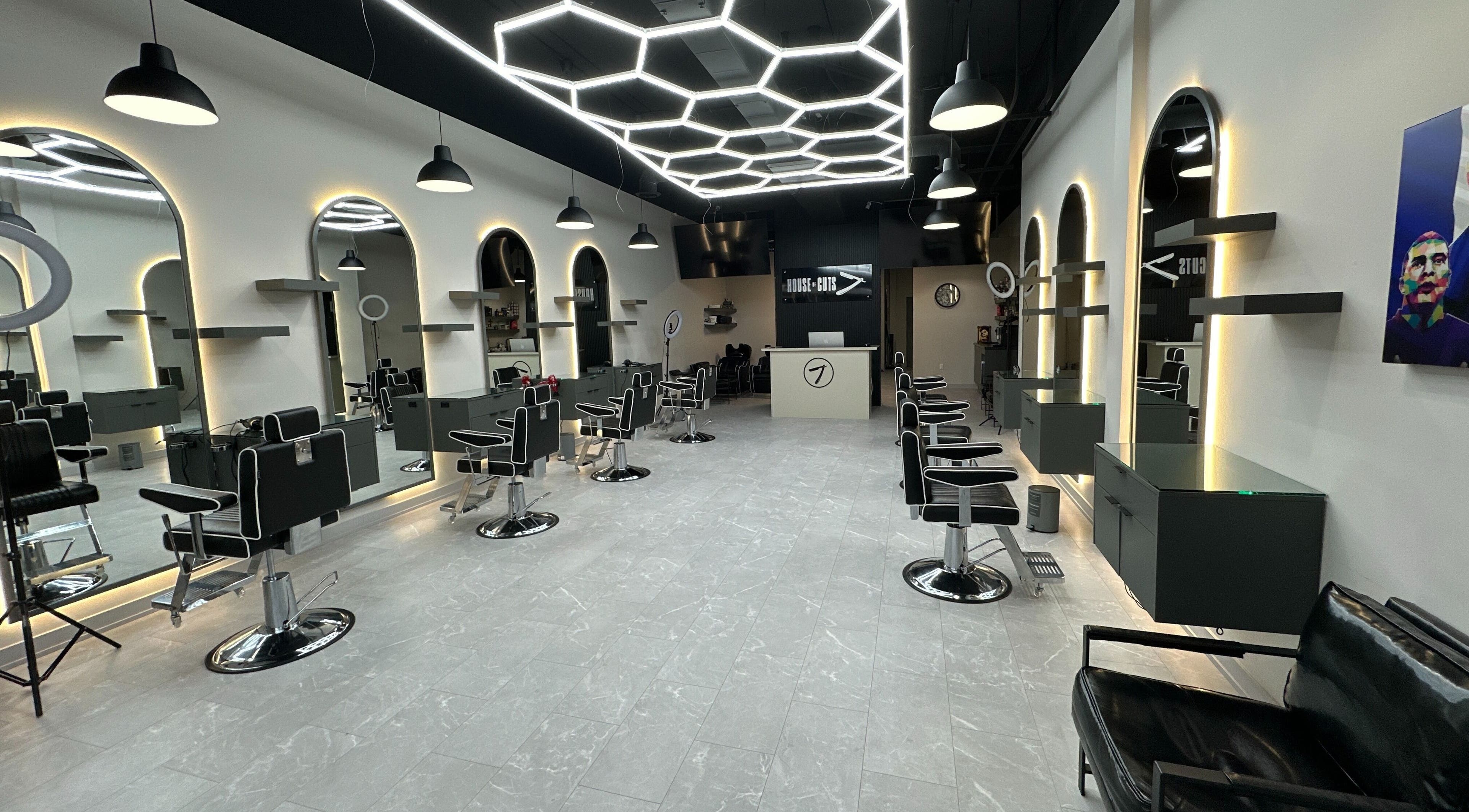 Modern styling chairs and mirrors at House of Cuts, Vaughan, Ontario, CA, showcasing sleek salon design.