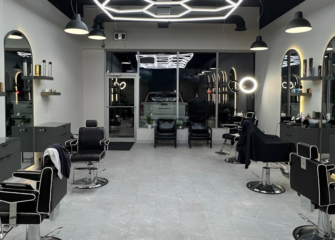 Modern interior of House of Cuts, Vaughan, Ontario, CA, featuring sleek barber chairs and stylish decor.