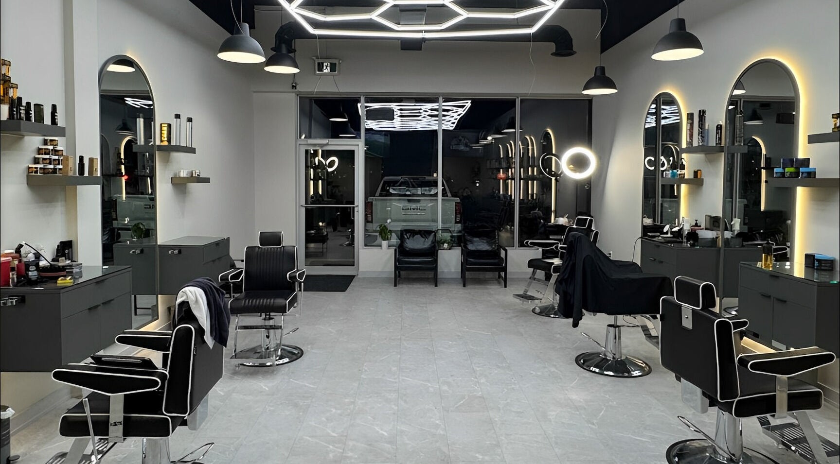 Modern interior of House of Cuts, Vaughan, Ontario, CA, featuring sleek barber chairs and stylish decor.