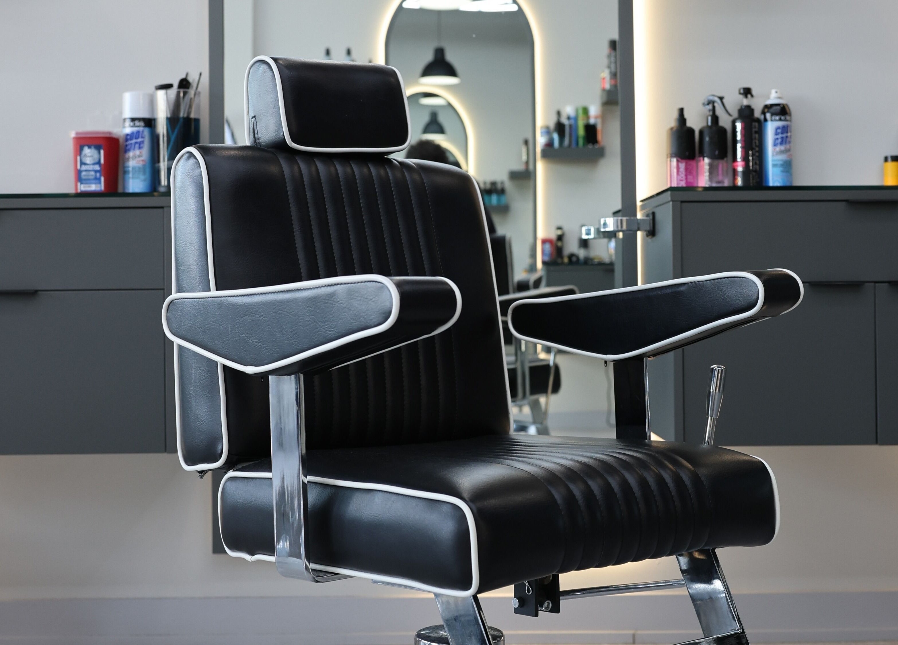 Modern barber chair at House of Cuts, Vaughan, Ontario, CA, offering a sleek grooming experience.