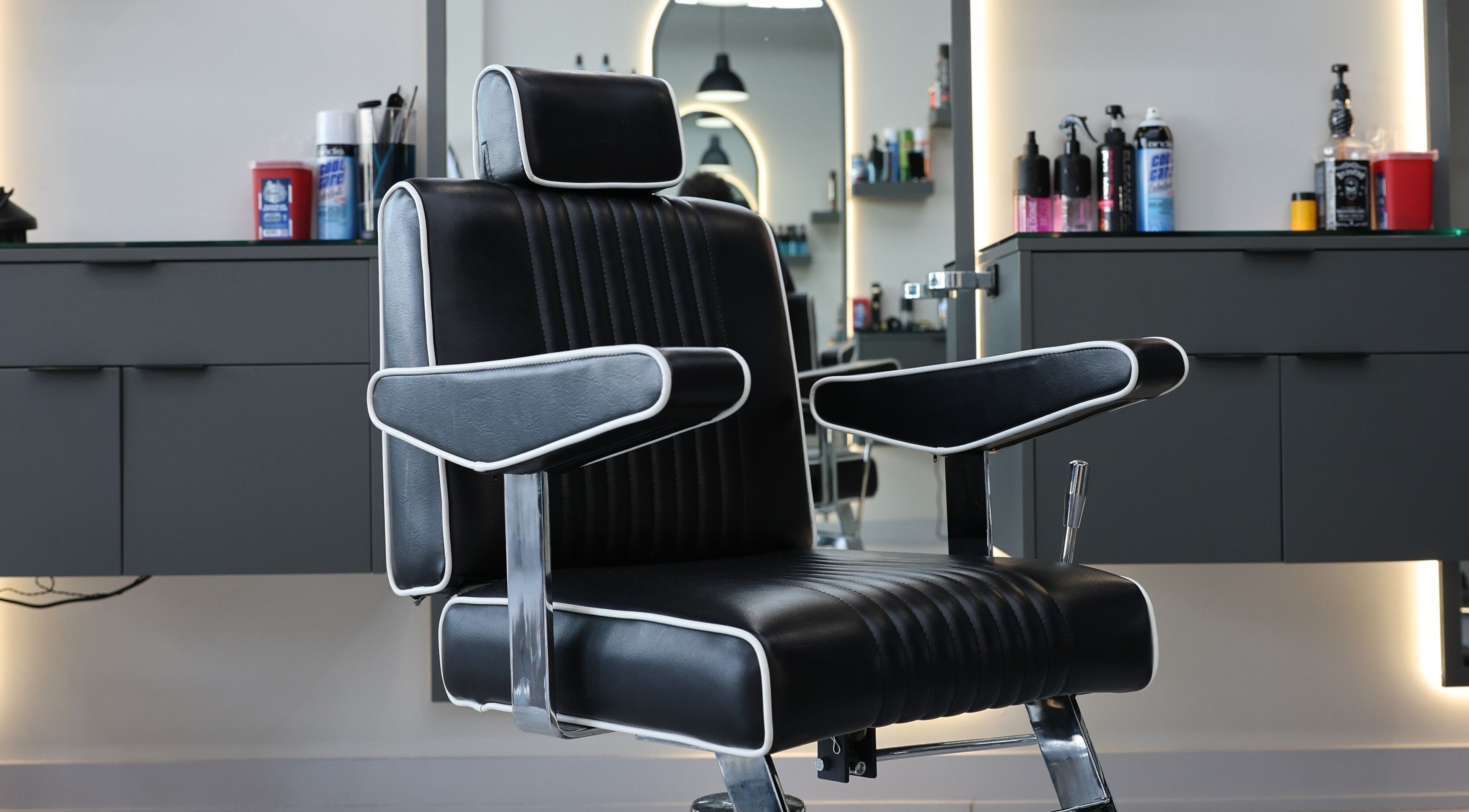 Modern barber chair at House of Cuts, Vaughan, Ontario, CA, offering a sleek grooming experience.