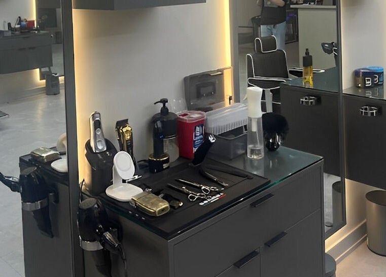 Modern styling station at House of Cuts, Vaughan, Ontario, CA, featuring sleek tools and lighting.