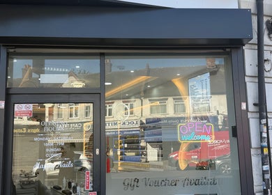 Happy Nails exterior showing signage and glass front in Bromley, England, GB. Inviting and modern salon entry.