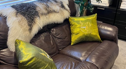 Elegant leather couch with green cushions at Apsara Wellness in Eastleigh, Southampton, Fair Oak, England, GB.