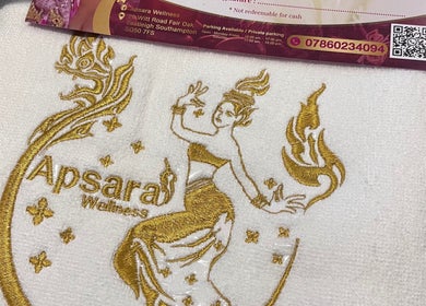 Apsara Wellness logo embroidered in gold on a towel at Fair Oak, Southampton, England, GB.