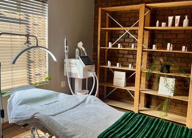 Cozy treatment room at Haze Aesthetics, Centurion, Gauteng, ZA with modern equipment and warm lighting.