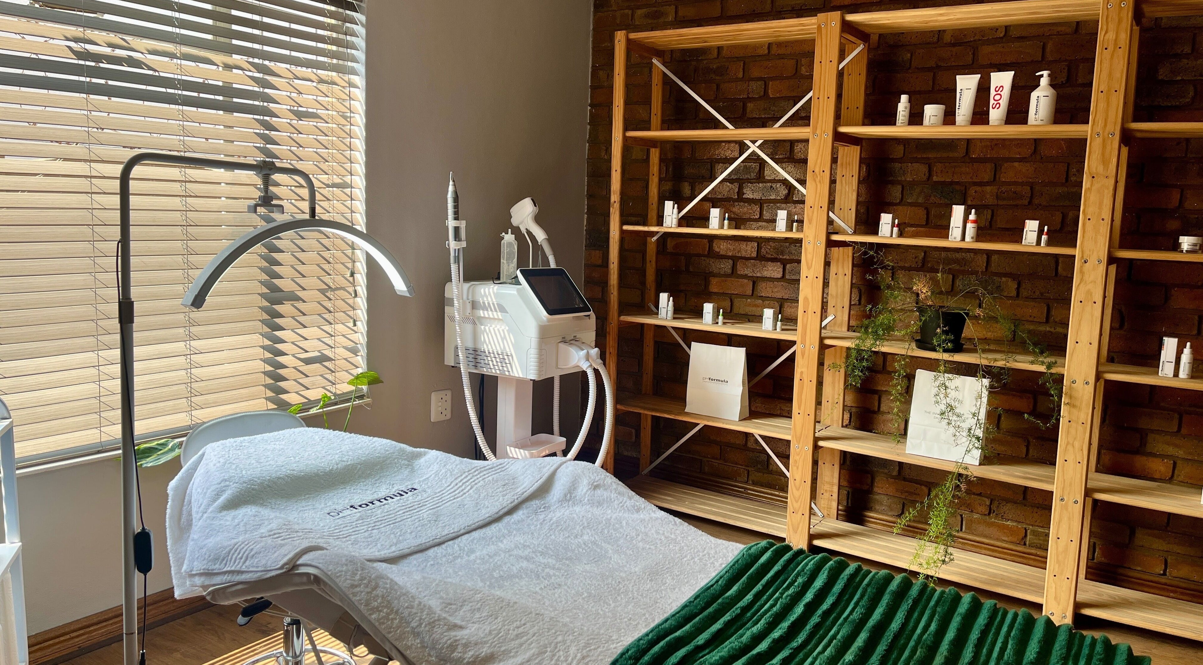 Cozy treatment room at Haze Aesthetics, Centurion, Gauteng, ZA with modern equipment and warm lighting.