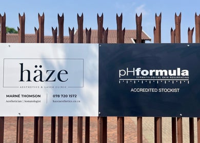 Haze Aesthetics sign displayed at entrance in Centurion, Gauteng, ZA, highlighting services and location.