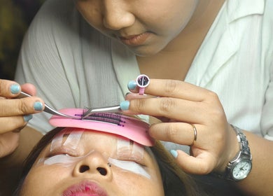 Lash extension session at Lashes By Me, Daerah Khusus Ibukota Jakarta, professional applying lashes with tweezers.
