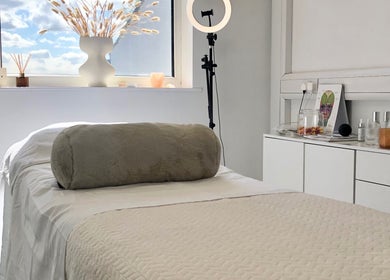 Calming treatment room at Skin by Cassie, Westhoughton, England, GB with a cozy therapy bed and natural decor.