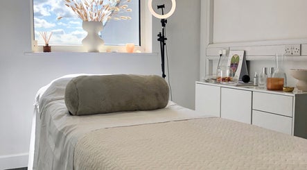 Calming treatment room at Skin by Cassie, Westhoughton, England, GB with a cozy therapy bed and natural decor.