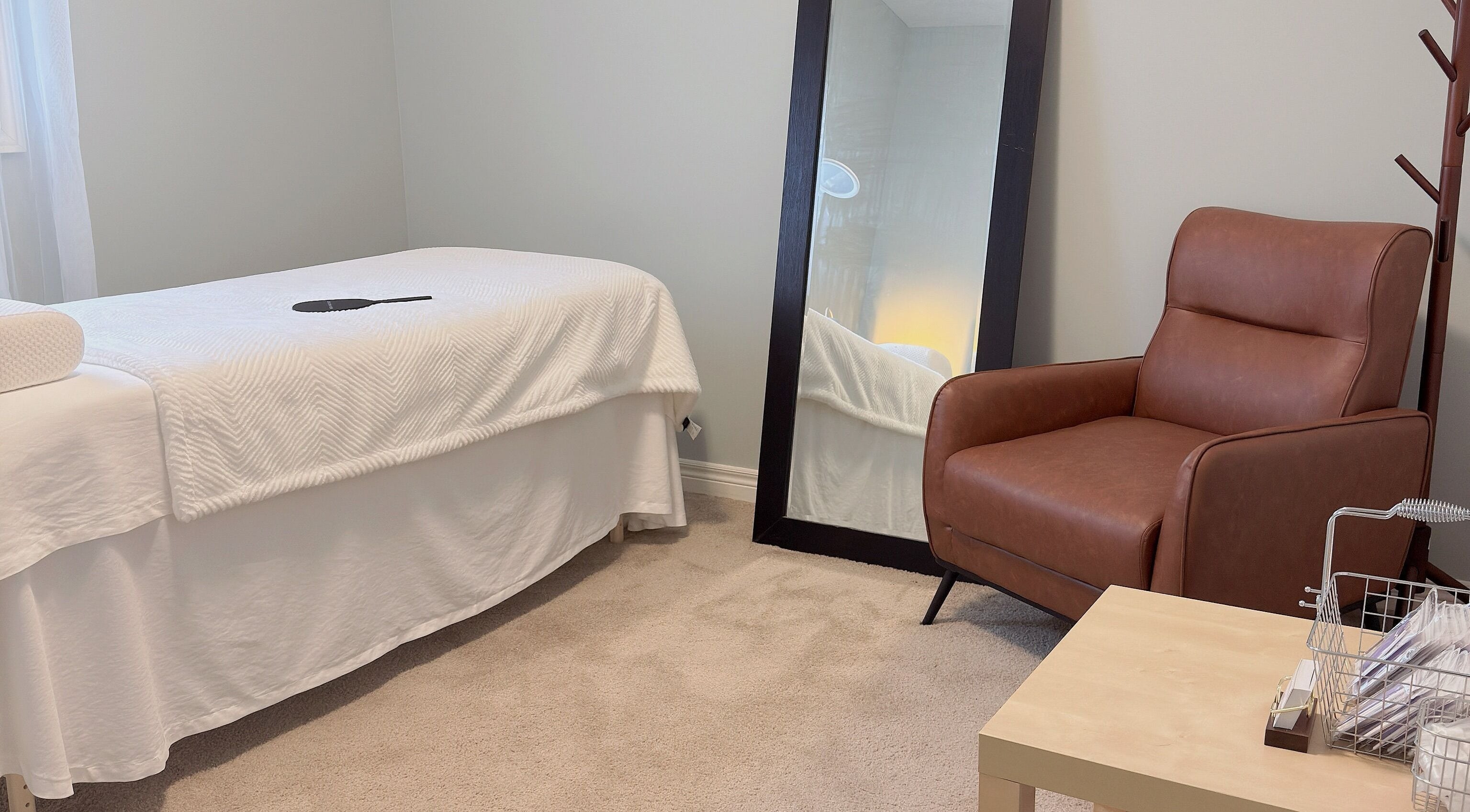 Comfortable treatment room at ✦ Vki Lash Studio ✦ in London, Ontario, CA, featuring a plush chair and mirror.