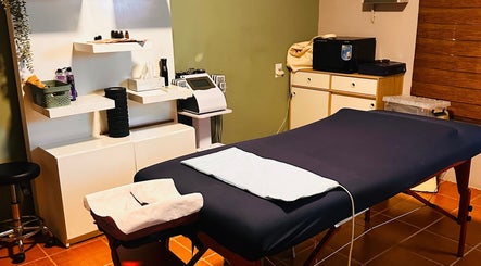 Therapy room at Bahia Relaxation Spa & Massage Curaçao, Willemstad, CW, featuring a massage table and modern decor.