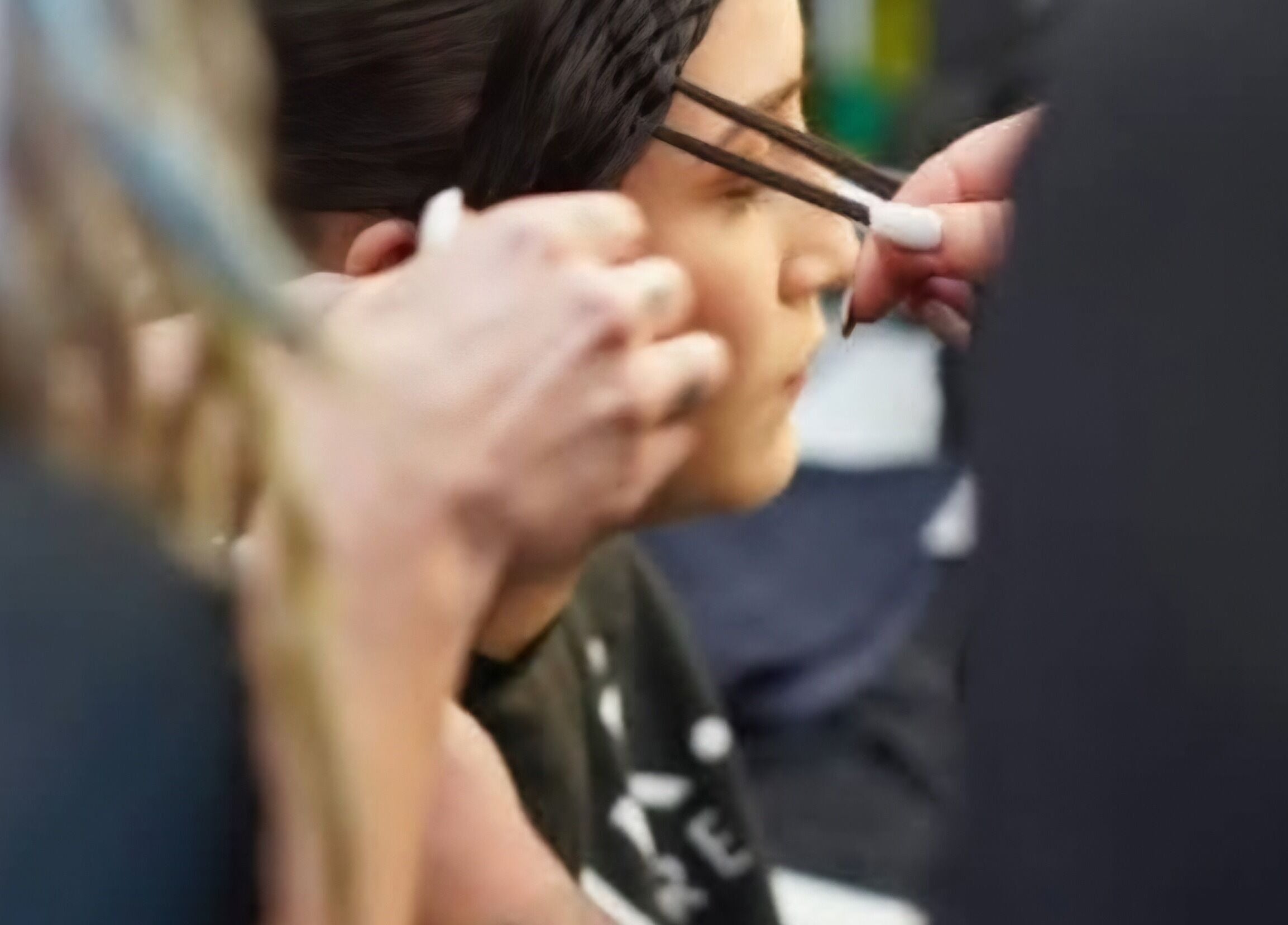 Stylist braiding hair at Little Hair Nation, Whangārei, Northland, NZ, showcasing expert hand techniques.
