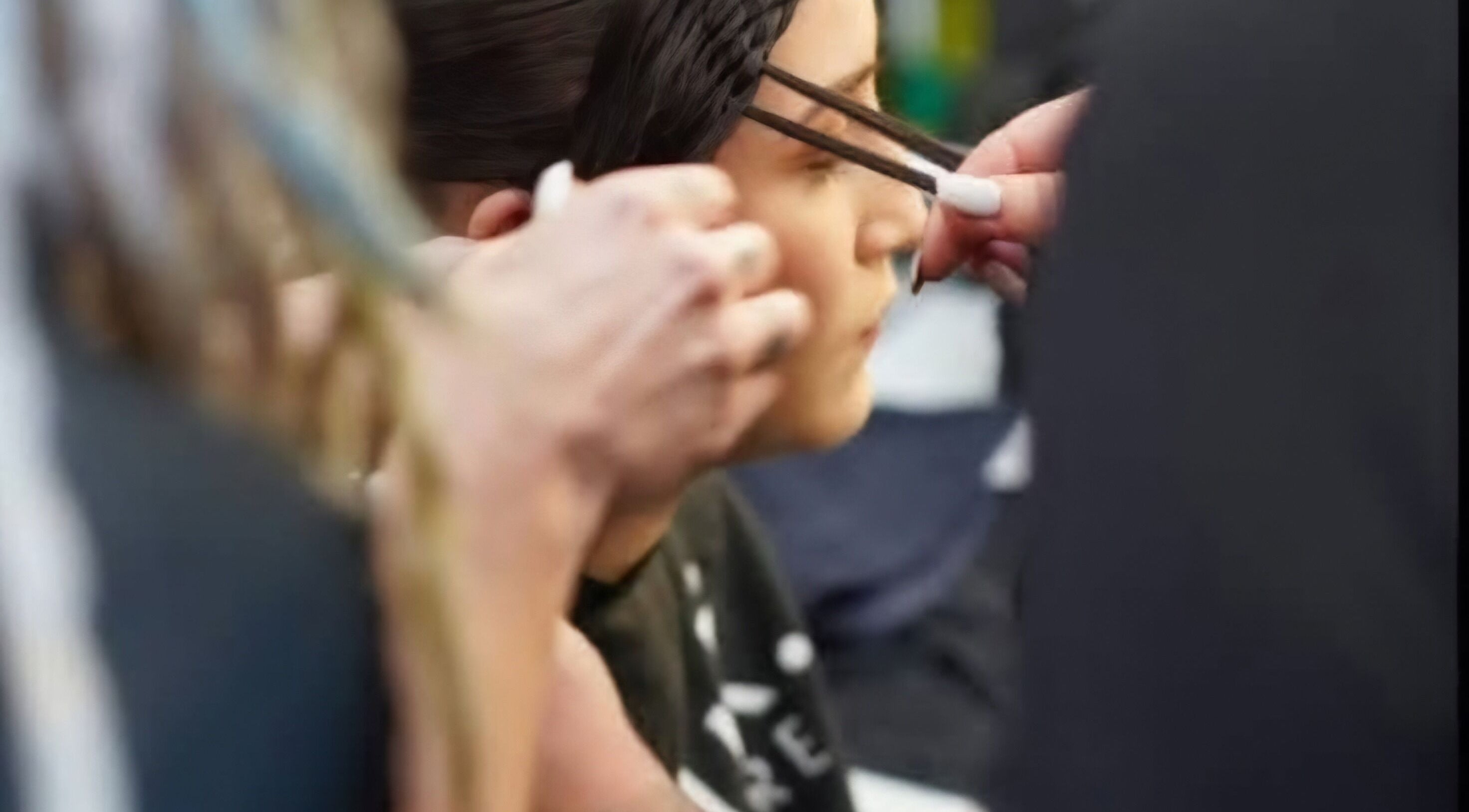 Stylist braiding hair at Little Hair Nation in Whangārei, Northland, NZ. Expert styling in progress.
