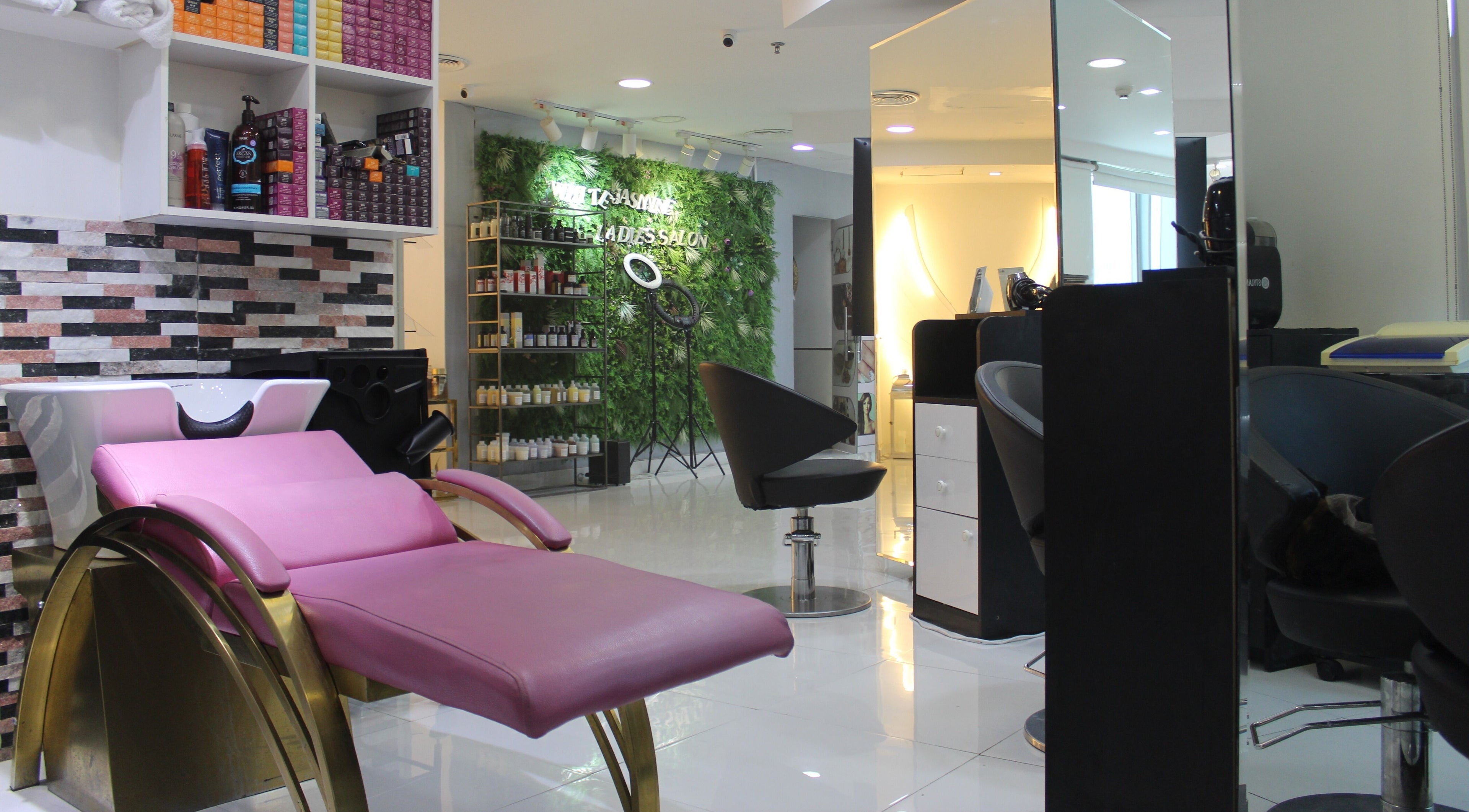 Relaxing interior of White Jasmin Ladies Salon in Dubai, Dubai, AE featuring modern styling chairs and products.