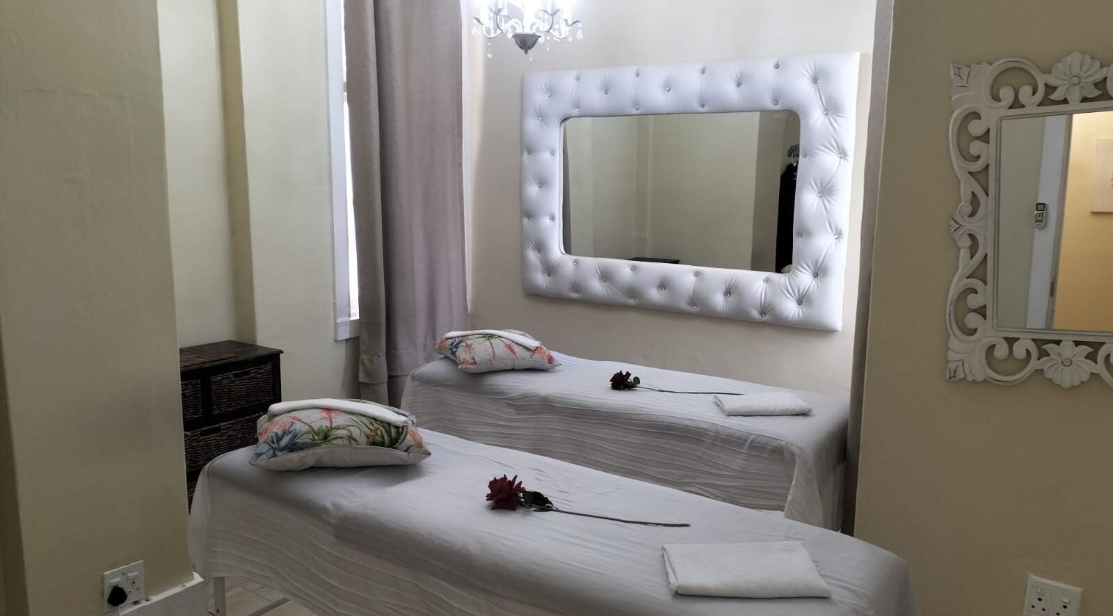 Relaxing treatment room at HEAVEN ON EARTH DAY SPA in Berea, Kwazulu-natal, ZA with decorated massage beds.