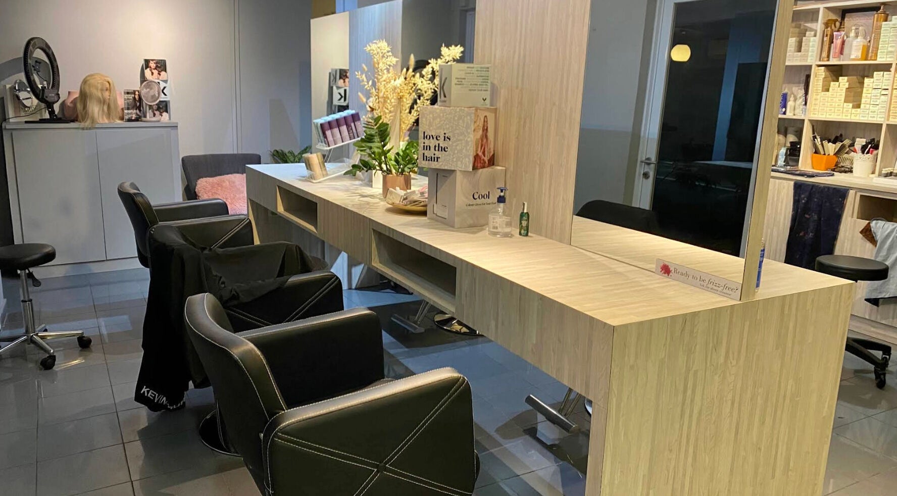 Chic and inviting salon interior at The Parlour, Singapore, Singapore, SG, with modern styling chairs and mirrors.