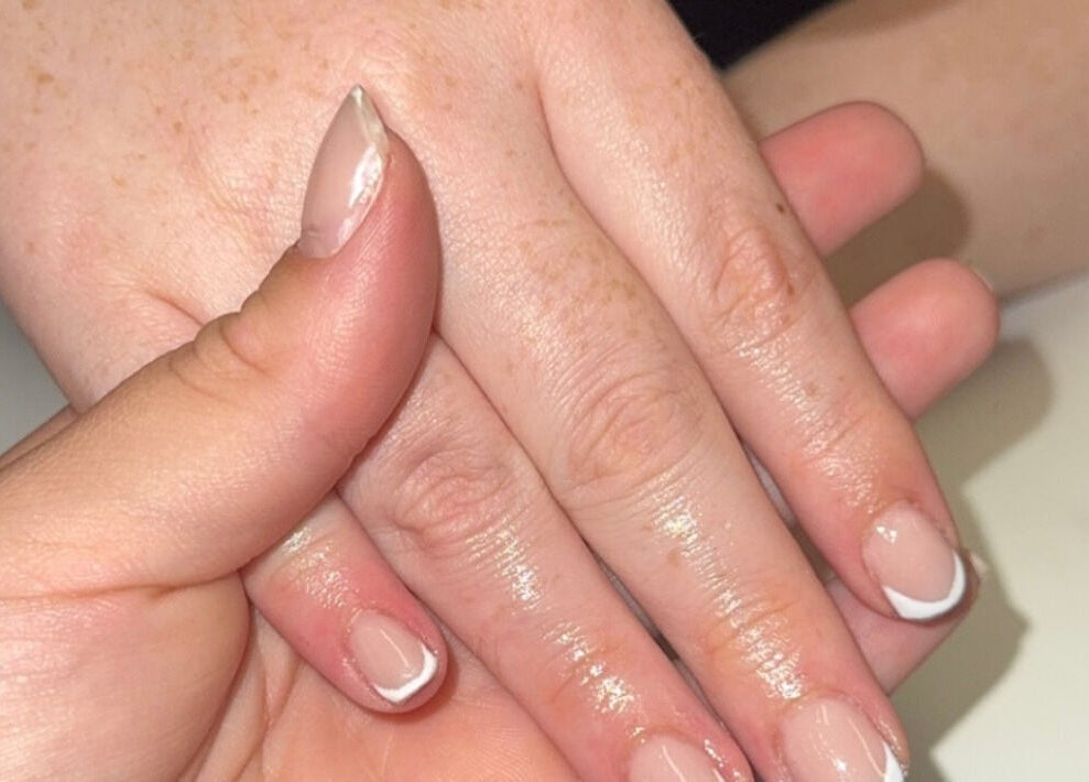 Freshly manicured nails at Beauté Bar, Dumfries, Scotland, GB, showcasing elegant nail art.